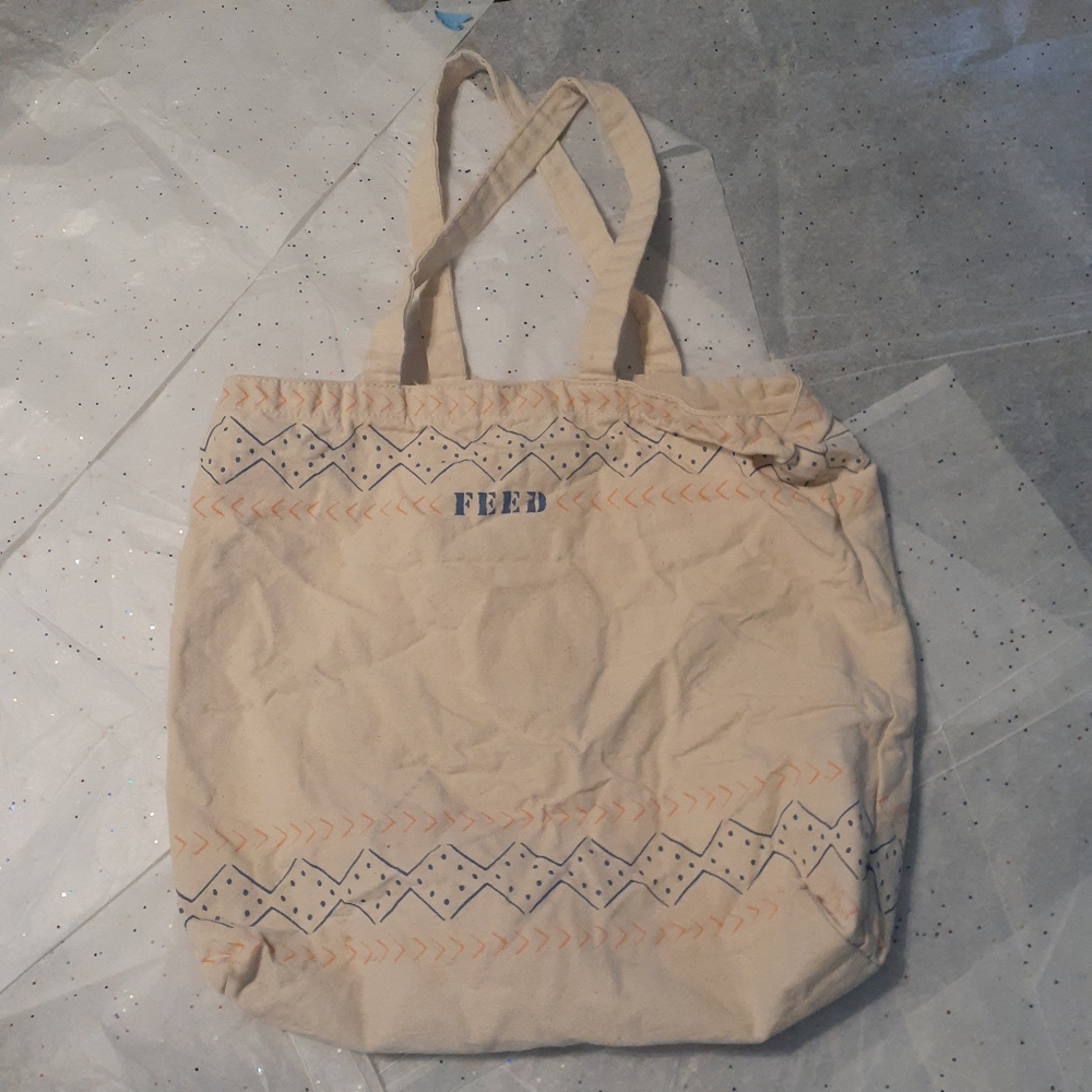 White tote bag with blue and pink details
